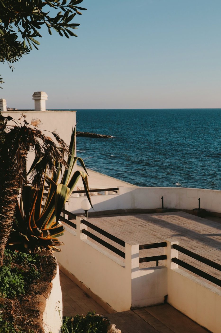 A sunlit Mallorca terrace overlooking the Mediterranean